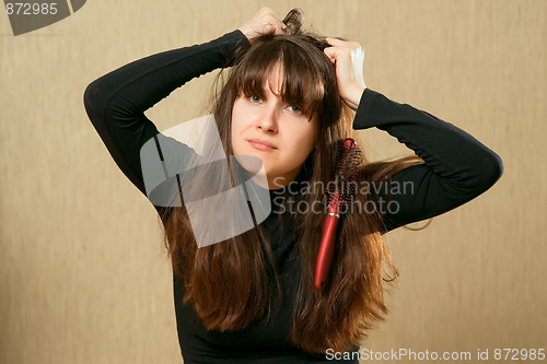 Image of Hairbrush in female hair