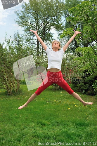 Image of Young woman practising - jump