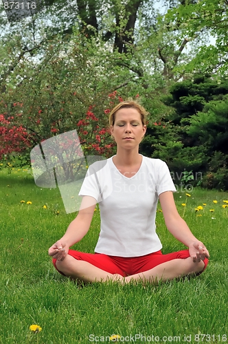 Image of Young woman doing yoga - meditation