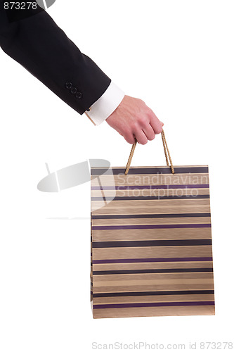 Image of detail of a hand of a man doing shopping,with bags 