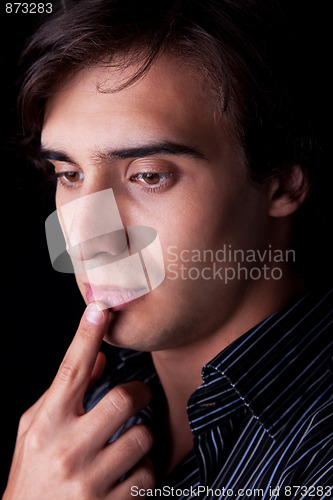 Image of Portrait of a handsome young man thinking