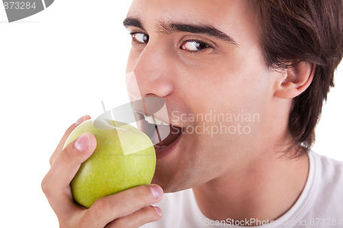 Image of man eating a green apple