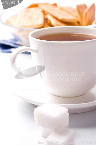 Image of cup of tea, sugar and cookies 