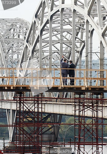 Image of two businessman on the bridge