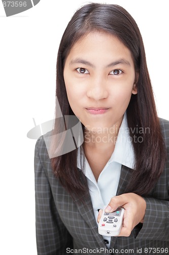 Image of Businesswoman pushing remote control