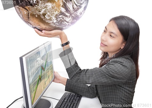 Image of Office worker holding globe