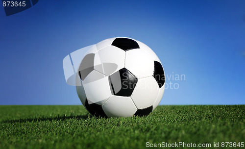Image of Photo of a soccer ball on grass 