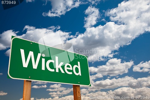 Image of Wicked Green Road Sign with Sky