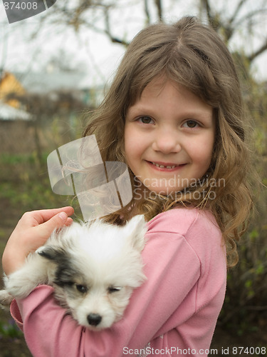 Image of girl and puppy