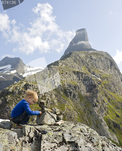 Image of Child building a cairn