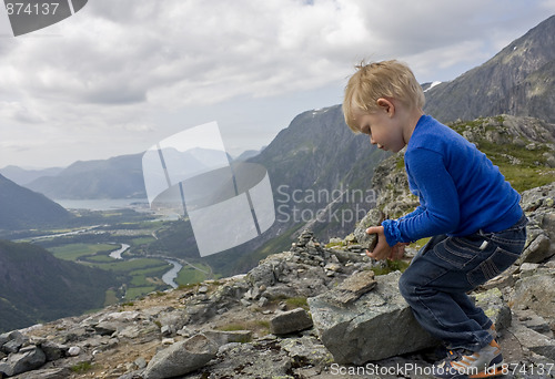 Image of Child building a cairn
