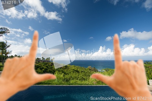 Image of Hands Framing Breathtaking Hawaiian Ocean View Deck and Pool