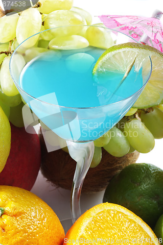 Image of Blue cocktail among fruits