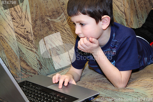 Image of small boy browsing on internet