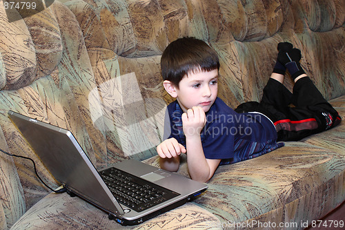 Image of small boy with notebook