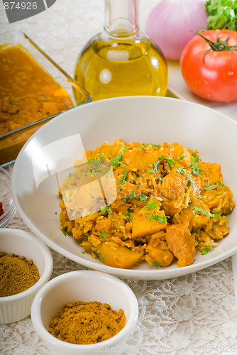 Image of curry beef rice and potatoes