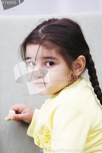 Image of Serene little girl in yellow
