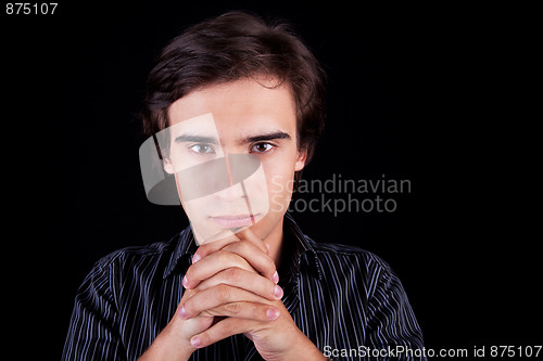 Image of Portrait of a young business man thinking