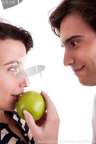 Image of Woman seducing a man eating an apple