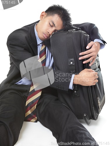 Image of Sleeping traveling businessman