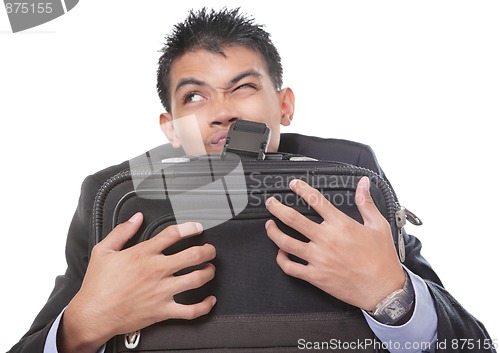 Image of Traveling businessman grasping case