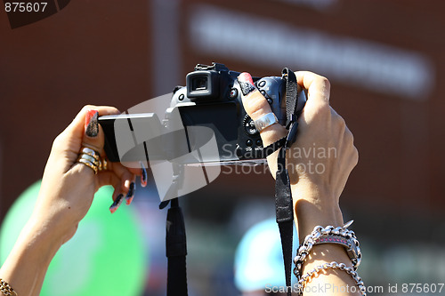 Image of Camera in women's hands