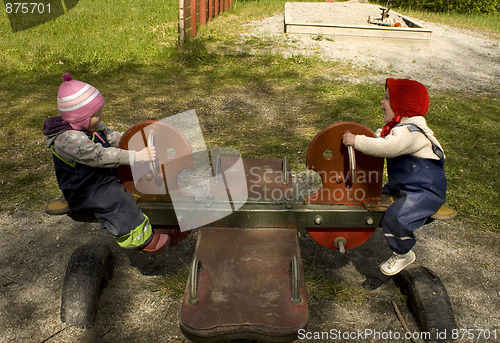 Image of Children on seesaw