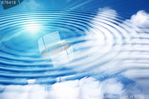 Image of Reflection white clouds and sun on the blue sky in water.