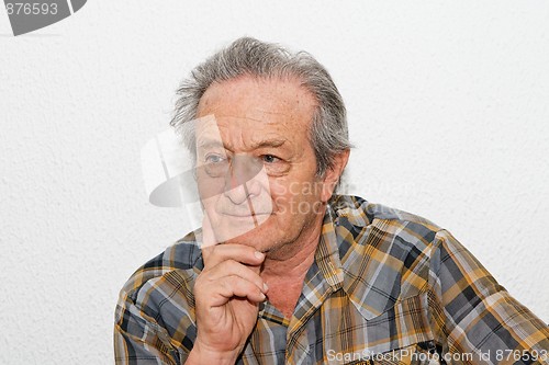 Image of Elderly man with thoughtful expression 