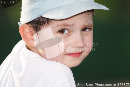 Image of Boy looking over shoulder