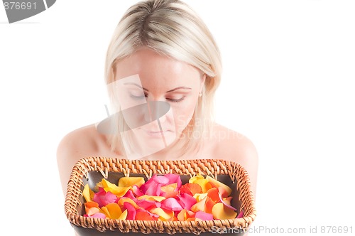 Image of Woman and petals on the plate