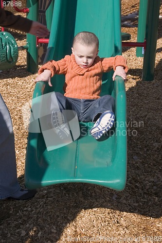 Image of Little Boy Sliding