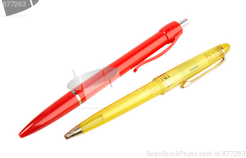 Image of Yellow and red ball point pens.
