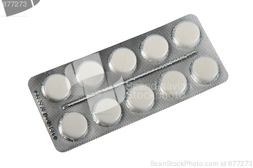 Image of White pills in metallic blister.