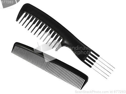 Image of Two black professional combs.