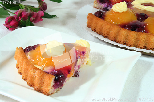 Image of a piece of fruit cake with an Alstroemeria