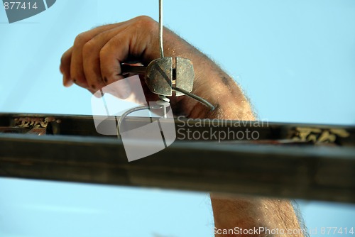 Image of Worker hand with nippers