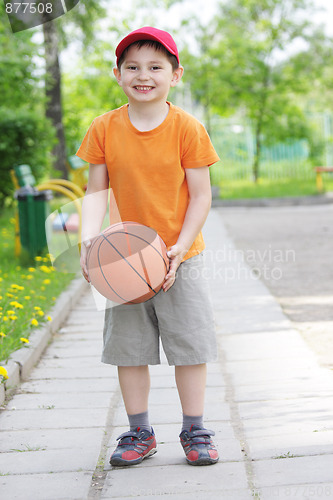 Image of Smiling boy with basketball