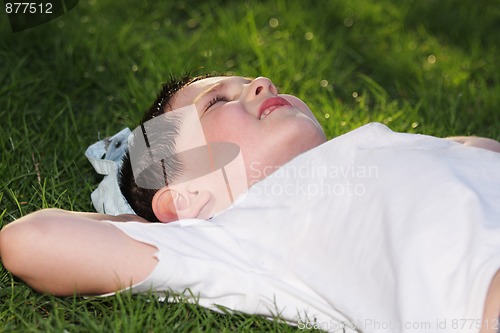 Image of Boy laying down in grass