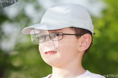 Image of Boy in eyeglasses looking sideways