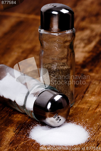 Image of salt and black pepper in shakers