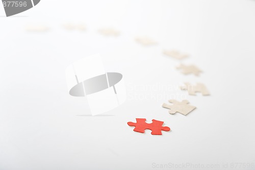 Image of red piece of puzzle