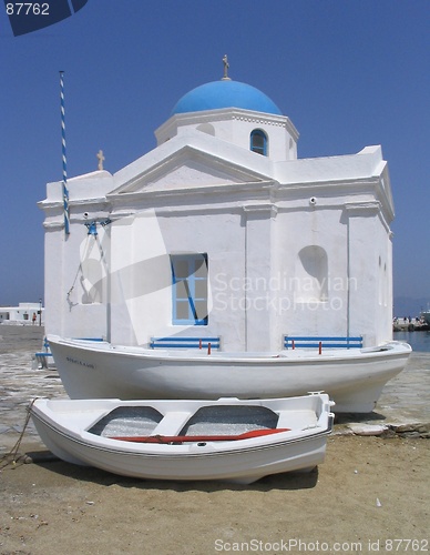 Image of Boats next to seaside church, Mykonos, Greece
