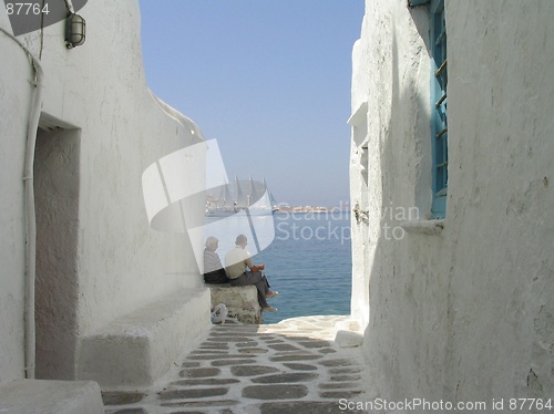 Image of Men relaxing at seaside house, Mykonos, Greece