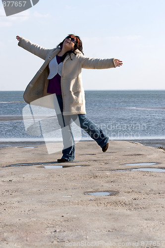 Image of Woman Dancing at the Beach