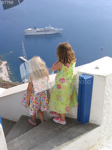 Image of Children watching boats at Oia, Santorini, Greece