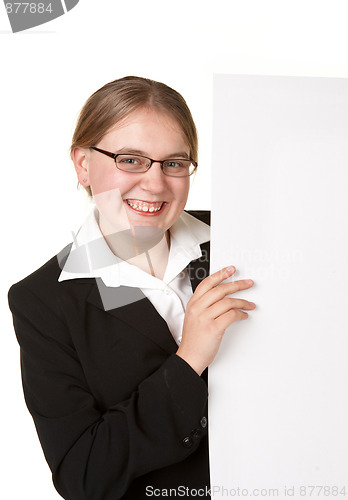 Image of business woman looks around sign