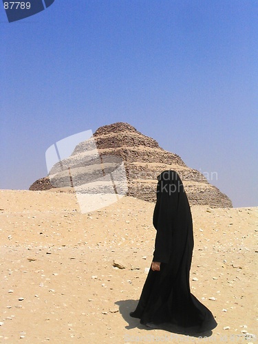 Image of Woman passing in front of Step Pyramid at Sakkara, Egypt