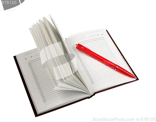 Image of Empty open diary and red ball point pen