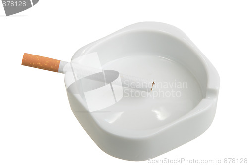 Image of White ashtray with cigarette